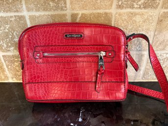 (HB-1) DANA BUCHMAN RED LEATHER HANDBAG - 10' BY 7'