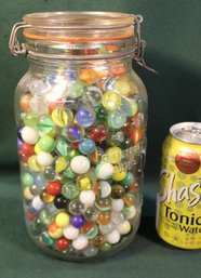Embossed 9'H  1/2 Gal Jar Of Glass Marbles   (34)