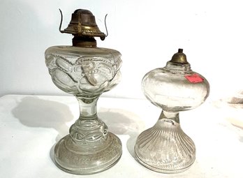 2 Pcs Lamps. 2 Clear Lass Lamps. 1 Pressed Glass W/burner, 1 Simple. Base Oil Burner