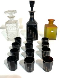 Three Old Bottles And 12 Glasses