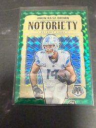 2024 Panini Mosaic Green Notoriety Amon-Ra St. Brown Football Trading Card