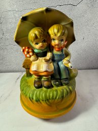 Vintage Ceramic Rotating Music Box By Himark Japan Boy And Girl Sitting On A Bench Under A Large Umbrella