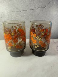Vintage Smoked Brown Glass Tumblers Featuring A Retro Orange And Yellow Floral Pattern