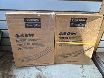 Two Boxes Of Simpson Strong-Tie Quick Drive Screws With Collated Quick Load Strips