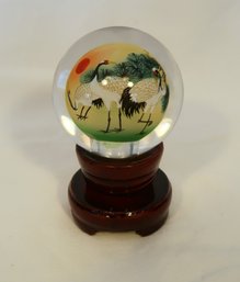 Reverse Painted Glass Orb With Cranes