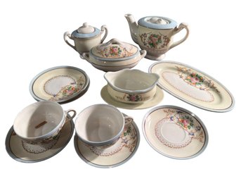 Japanese Porcelain Tea Set With Floral And Scrollwork Patterns