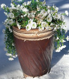 Brown Ceramic Planter With White Artificial Flowers