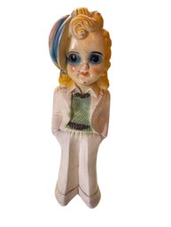 13-Inch Ceramic Figurine With Curled Hair And Green Sweater Detailing