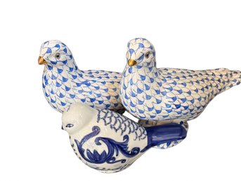 Three Blue And White Ceramic Dove Figurines With Decorative Patterns