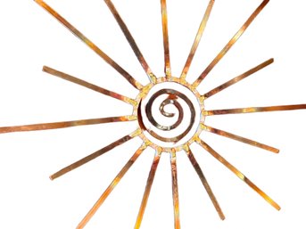 Decorative Sunburst Design On Burnt Orange Cushion