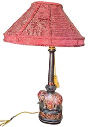Elephant-Themed Table Lamp With Red Fabric Shade