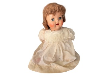 Composition Doll With Painted Features And Auburn Mohair Wig In White Embroidered Dress