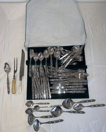 Silverware Set, Set Includes A Variety Of Pieces, Such As Forks, Knives, Spoons, And Serving Utensils.