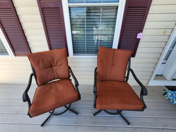 177 - PAIR OF SWIVEL PATIO CHAIRS WITH RUST CUSHIONS
