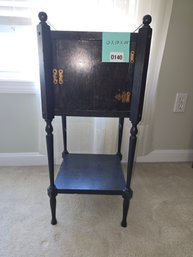 140 - ANTIQUE BLACK WOOD ACCENT TABLE WITH HINGED TOP & BOTTOM SHELF