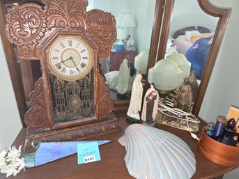141 - ANTIQUE ORNATE WOODEN MANTEL CLOCK W/ RELIGIOUS FIGURINES & DECOR LOT
