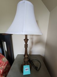 010 - TABLE LAMP WITH WHITE BELL SHADE AND BRONZE BASE