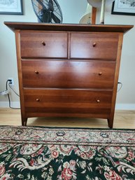 011 - FOUR-DRAWER WOODEN DRESSER