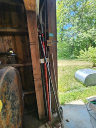 124 - ASSORTED LONG-HANDLED GARDEN TOOLS AND PRUNERS