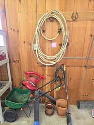 084 - GARDEN TOOLS, HOSE, SPREADER, AND PLANT POTS