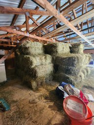114 - STACK OF HAY BALES IN BARN LOFT - HAY WAS CUT IN JUNE OF 2025