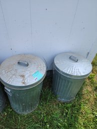 135 - TWO GALVANIZED STEEL TRASH CANS