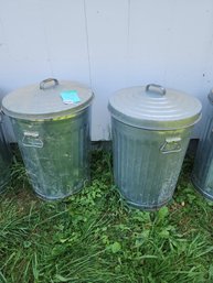 134 - TWO GALVANIZED STEEL TRASH CANS