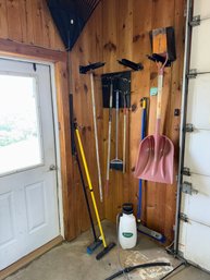 060 - ASSORTED GARDEN TOOLS INCLUDING RAKES, SHOVELS, AND BROOMS