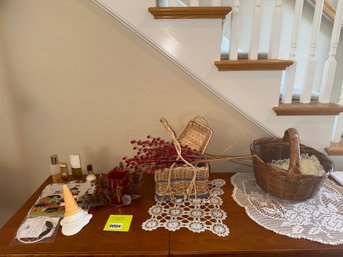 004 - ASSORTED DECOR LOT  BASKETS, CROCHET DOILIES, CANDLE, PERFUMES & FLORALS