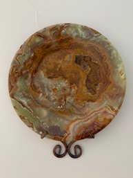 Natural Decorative Onyx Plate Featuring Swirling Bands Of Amber, Brown, And Green