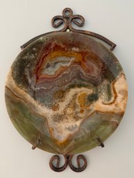 Natural Decorative Onyx Plate Featuring Swirling Bands Of Amber, Brown, And Green