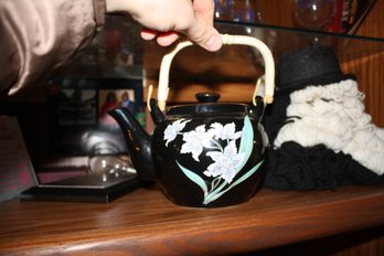 Black Ceramic Teapot With Gold Accents And White Iris Floral Design With Removable Wicker Handle