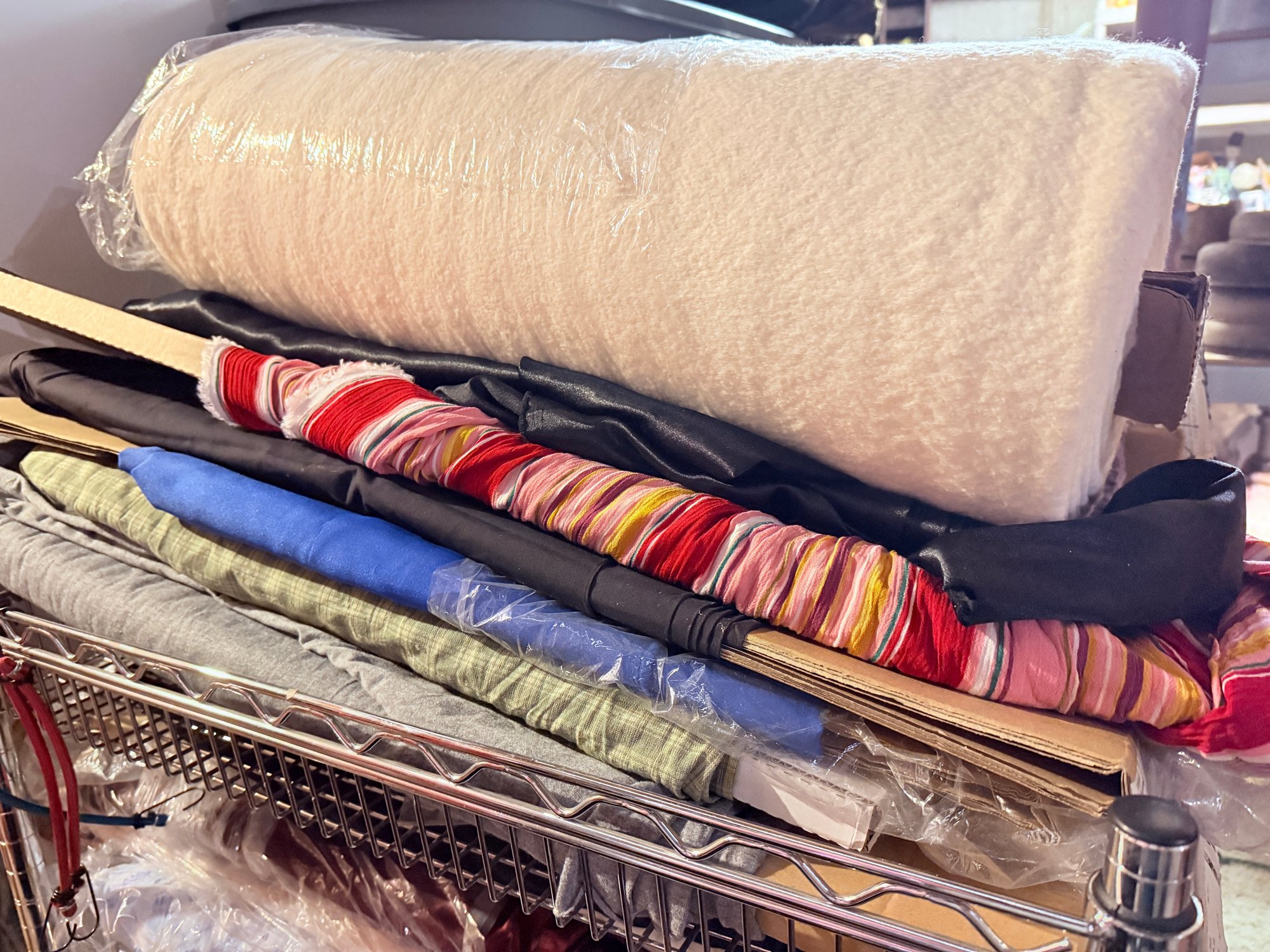 Small Wire Rack With LOTS Of Bolts Of Fabric And Bin Of Fabric Pieces ...