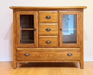 Solid Wood Cabinet With Glass Doors And Multiple Drawers