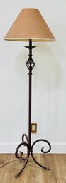 Wrought Iron Floor Lamp With A Scrolled Base