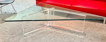 Mid-century Modern Coffee Table Featuring A Clear Lucite Geometric Base And A Thick Glass Top