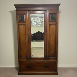 Antique Mahogany Wardrobe Armoire With Beveled Mirror And Carved Accents