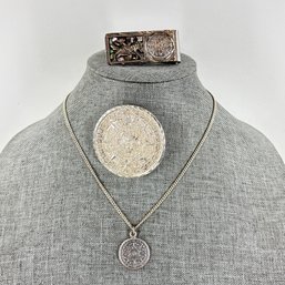 Sterling Silver Aztec Calendar Necklace, Pendant Brooch, And Money Clip Total Weight 63 Grams