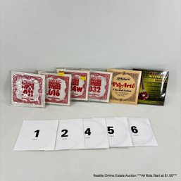 11 Packages Of Assorted Guitar And Sitar Strings