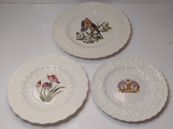 3 White Ceramics Plates With Designs In The Center