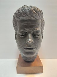 Collectible Dark Gray-colored Plaster Bust Sculpture Depicting President John F. Kennedy