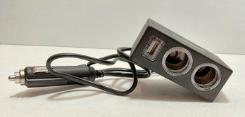 Car And Driver LED Car Charging Station With Two 12V Sockets And A USB Port.