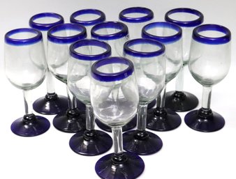 Lot Of 12 Hand Blown Mexican White Wine Glasses With Blue Trim.