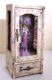 Distressed Miniature Cabinet With Elegantly Dressed Resin Figurine Inside.