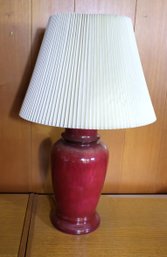 Cranberry Color Table Lamp With Grey Veining In A Ginger Jar Shape, And With Plastic Pleated Shade.