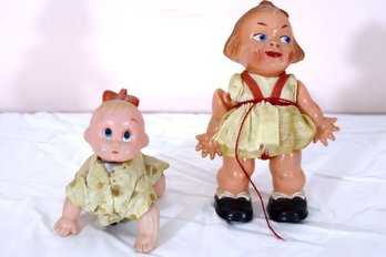 Two Antique Hard Plastic Dolls, Including A Mechanical Crawling Baby.