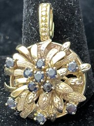 14K Yellow Gold Flower Design Pendant With Sapphire Stones.