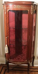 French Style Vitrine Or Display Cabinet With Bow Front Mahogany Frame And Ormolu Surrounding The Glass Sides.