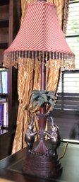 Contemporary Resin Lamp With Elephants And Palm Tree. Includes Striped Fabric Shade With Beaded Fringe