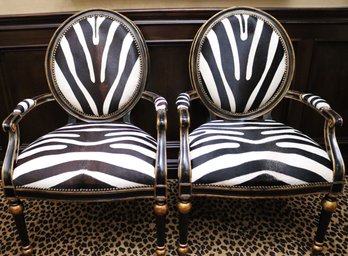 Pair Of Maitland Smith Safari Chairs With Black Painted Finish, Gold Highlights And Zebra Patterned Upholstery